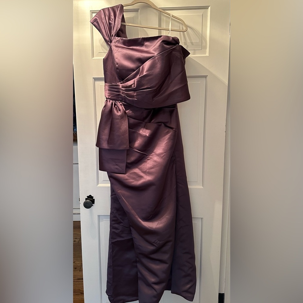 Spectacular plum one shoulder formal long gown.  New with tags.  Never worn